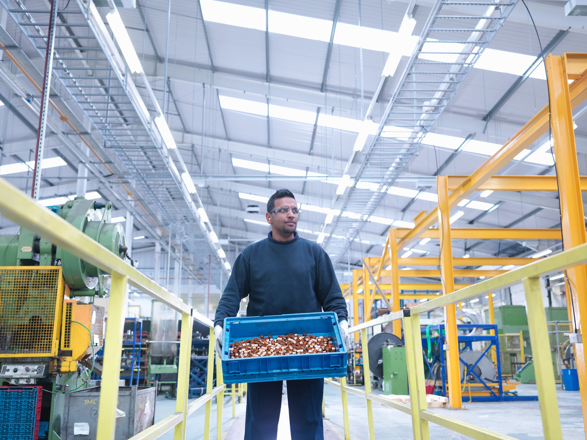 Engineer carrying product in engineering factory